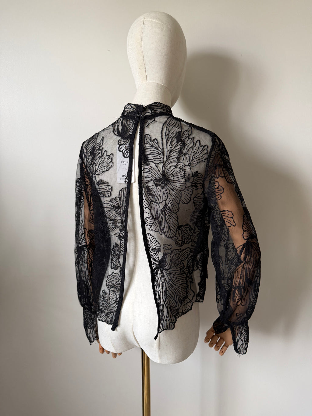 Long-sleeved lace top with open back