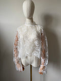 Long-sleeved lace top with open back