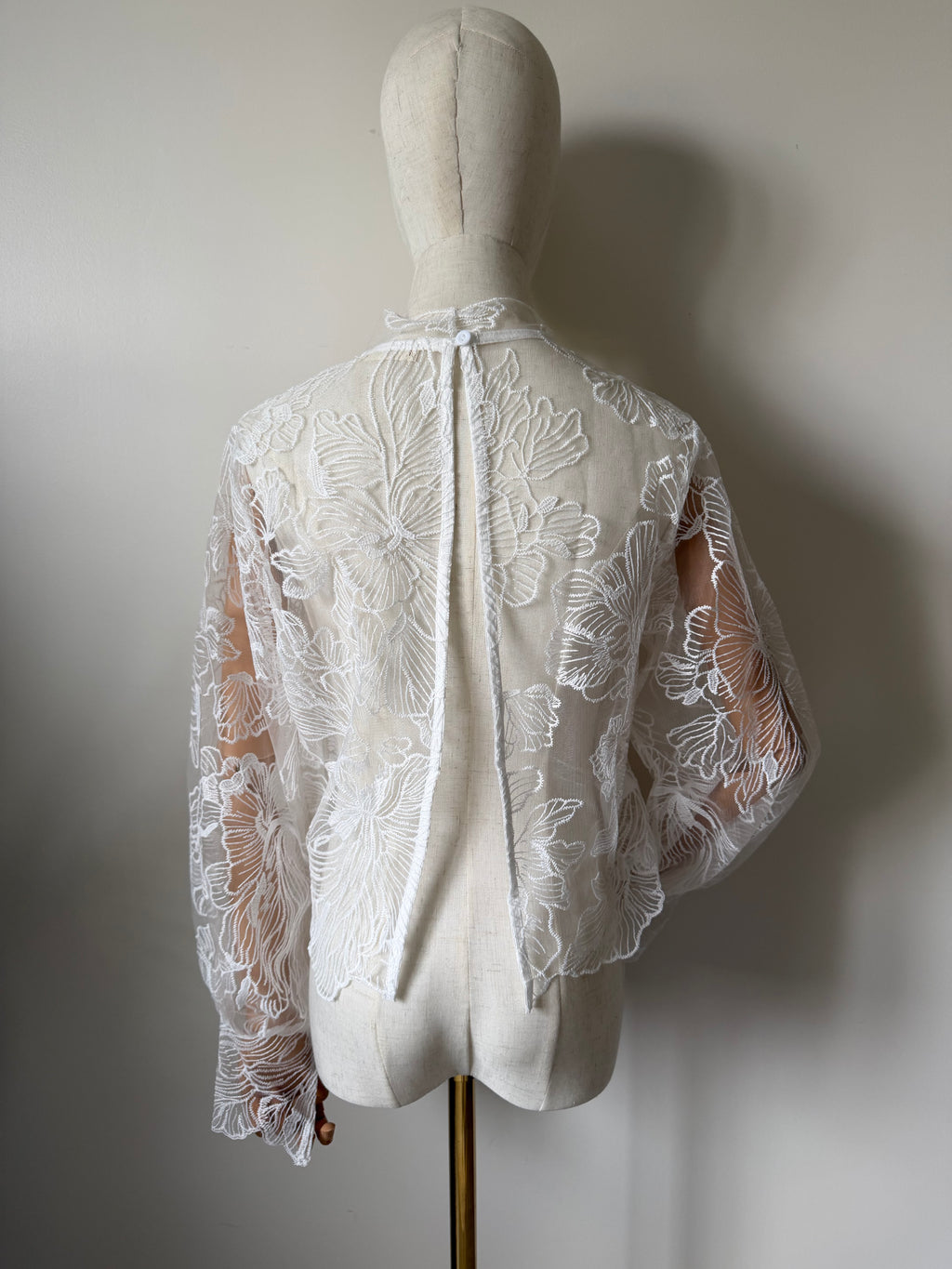 Long-sleeved lace top with open back