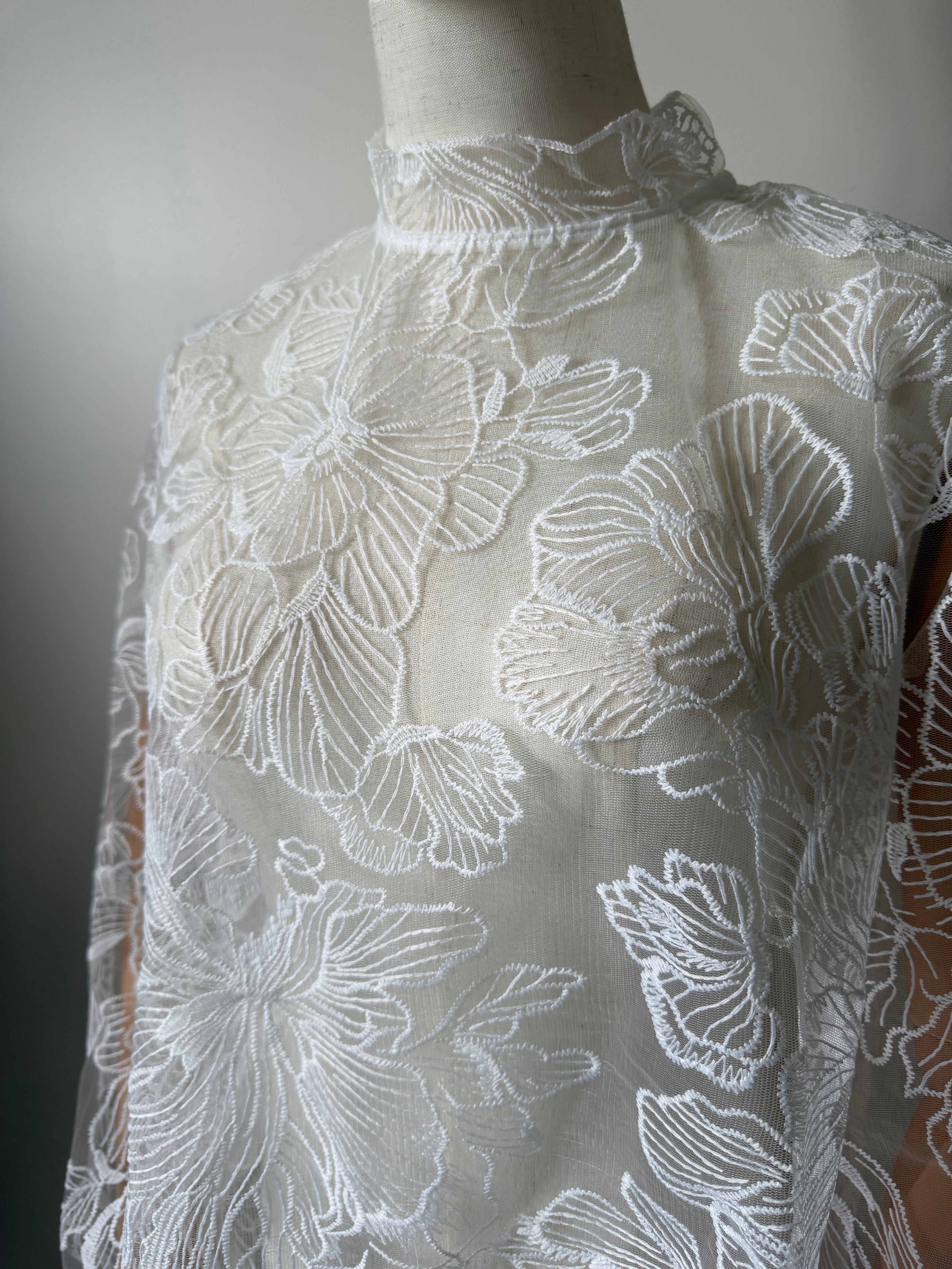 Long-sleeved lace top with open back
