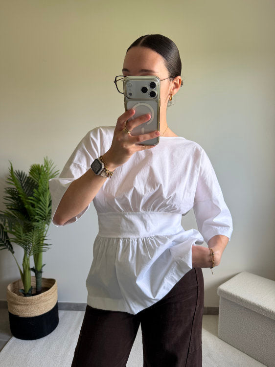 Blouse manches courtes avec nœud dans le bas du dos