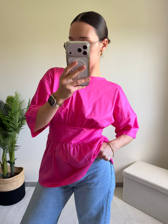 Blouse manches courtes avec nœud dans le bas du dos