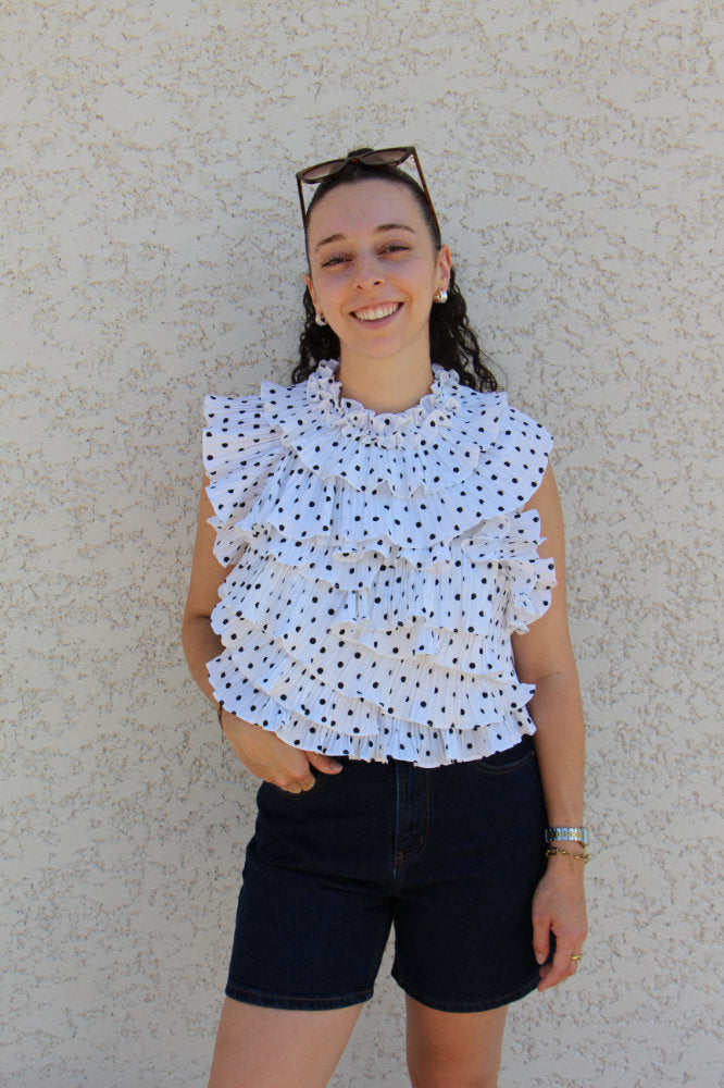 Blouse sans manches avec pois noirs effet ruché dos nu