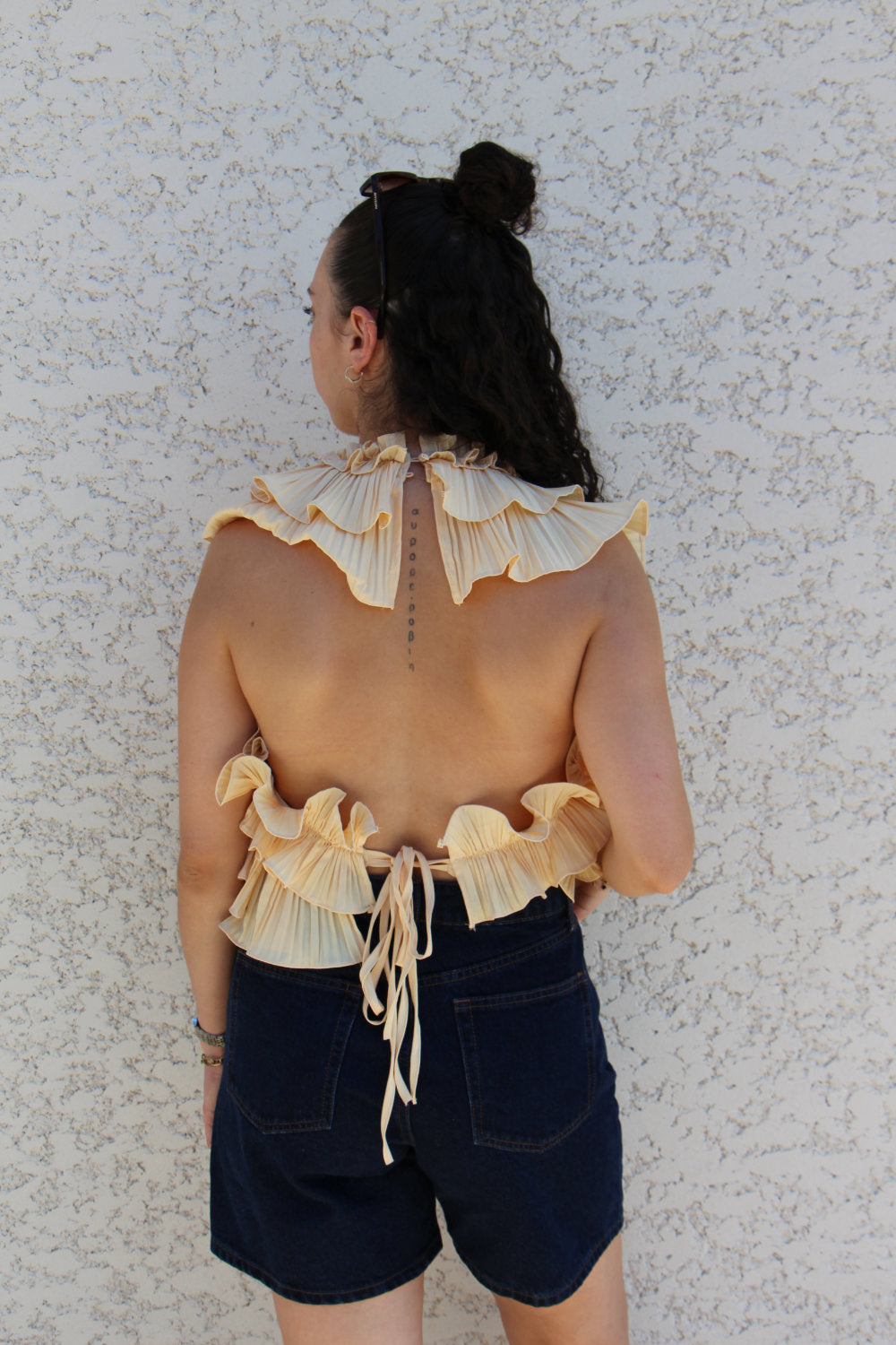 Blouse sans manches effet ruché dos nu